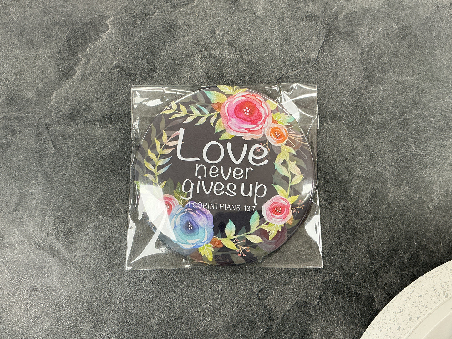 Love never gives up pocket mirror