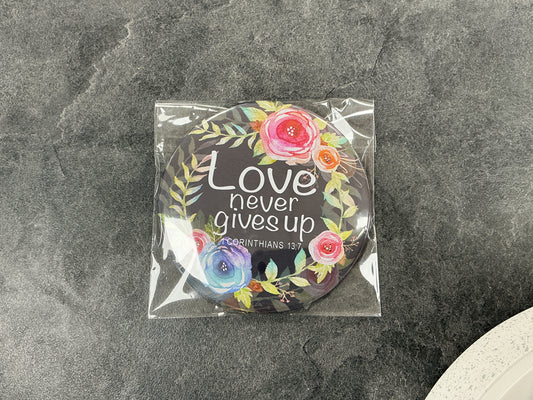 Love never gives up pocket mirror